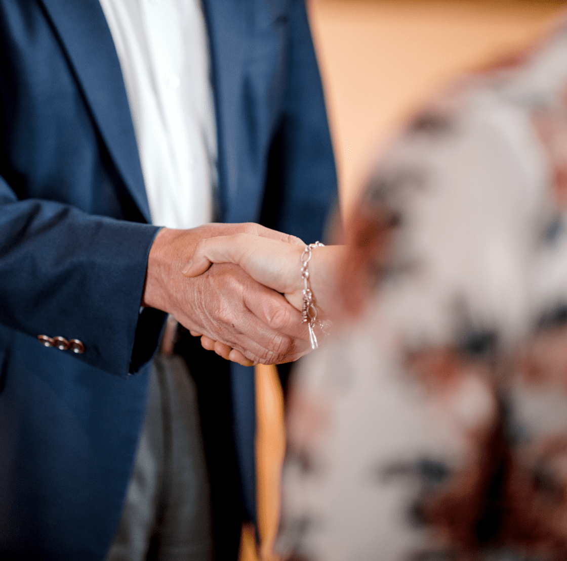 A man and woman shaking hands.